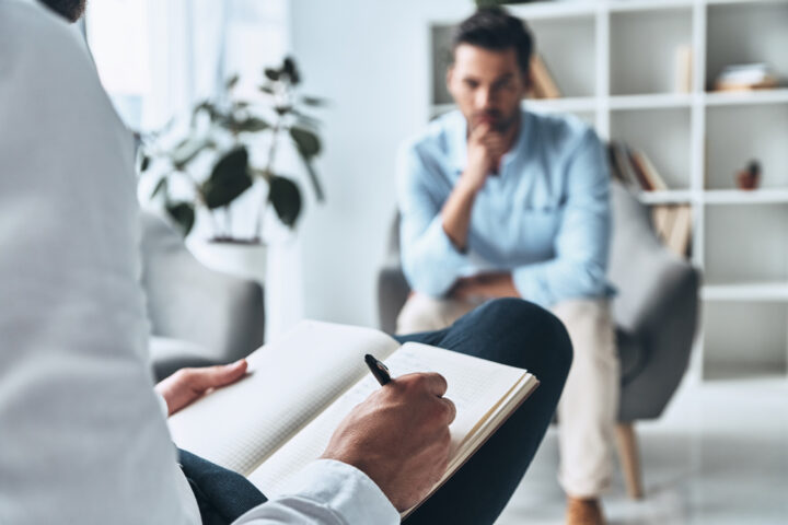 Young Man Engaged in Therapy Session